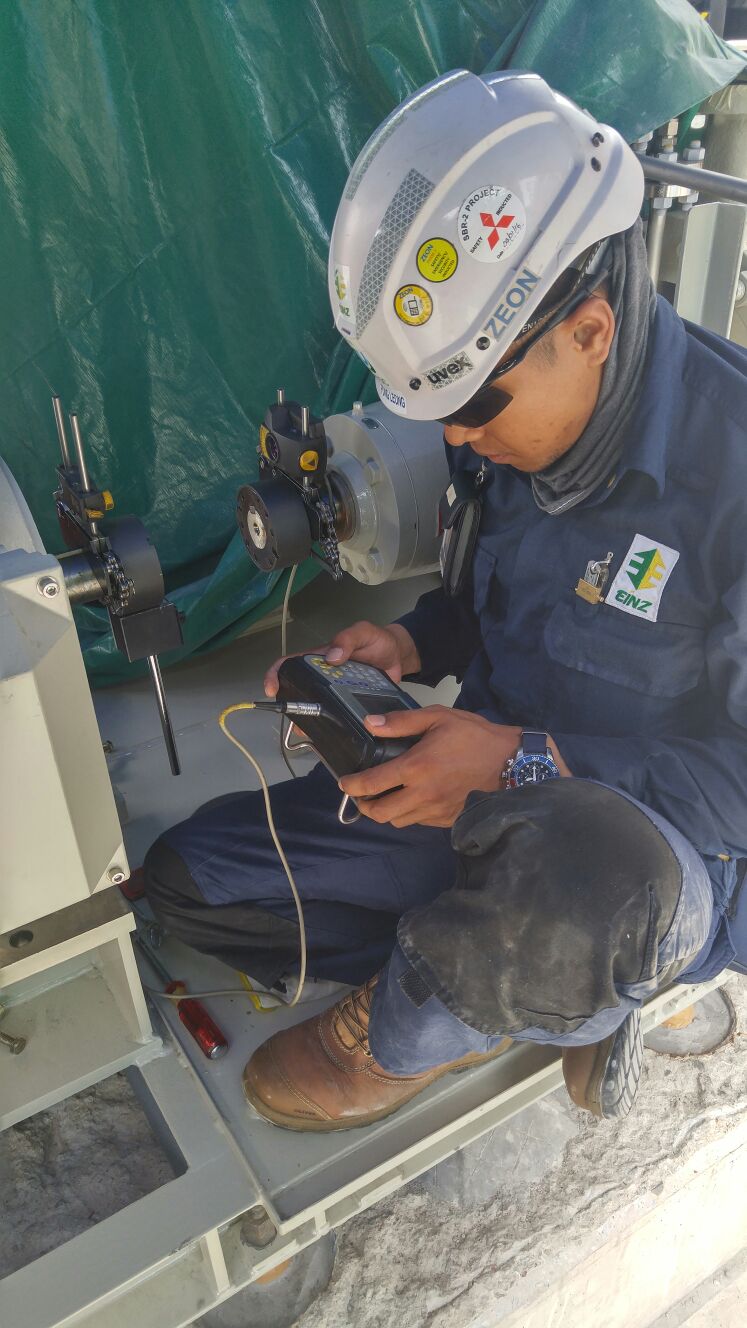 Technician performing precision laser pump alignment